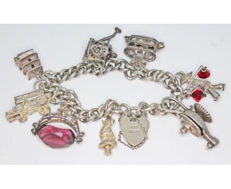 A hallmarked silver charm bracelet, length 14cm, gross weight 45.96g.  