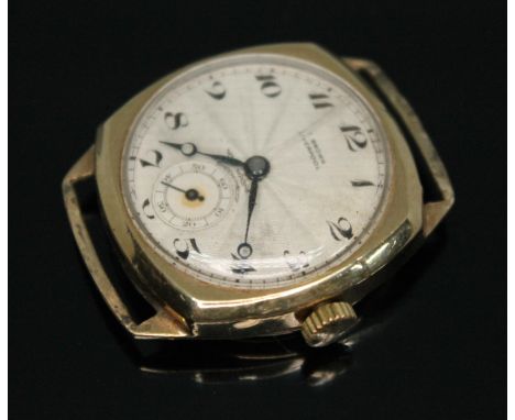 A 1930s hallmarked 9ct gold wristwatch, the guilloche decorated dial signed 'T.Brown, Liverpool' and having Arabic numerals, 