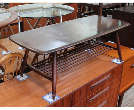 An Ercol coffee table.&nbsp;Condition - split to top which has been filled, general wear including scuffs and scratches throu