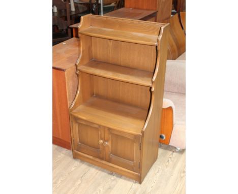 An Ercol waterfall bookcase.  