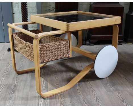 Alvar Aalto (1898-1976), a Modernist birchwood tea trolley designed for Artek, circa 1936, with black tile lined gallery, low