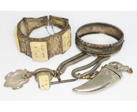 A mixed lot of mainly eastern white metal including a bangle, a vesta case modelled as a tiger's claw with elephant finial, s