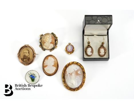 An early 20th century 9ct gold cameo with a photograph 42 x 35mm, shell cameo with 9ct gold frame 40 x 34 mm (base metal pin)