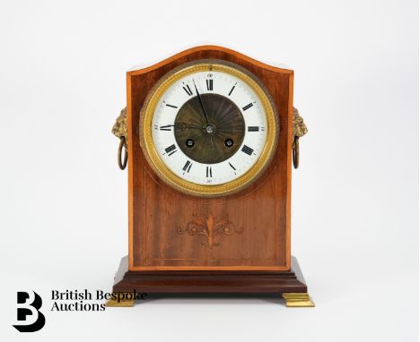 Early 20th century mantel clock, with French movement, sloping case with boxwood inlay, Roman numerals on white enamel chapte
