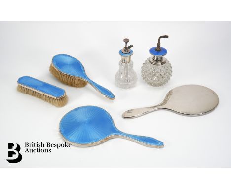 An early 20th century silver and blue enamel vanity set, comprising hand mirror, hairbrush, clothes brush, atomizer Birmingha