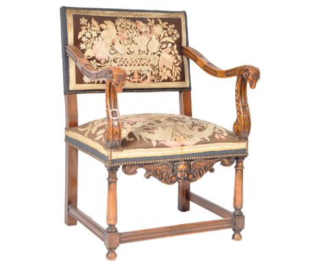 A 20th Century walnut tapestry throne carver armchair in the manner of an 18th Century example. The chair having a single tap