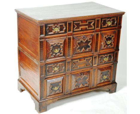 A 17th Century Jacobean oak and walnut two piece chest of drawers having a configuration of one shallow drawer over one deep 