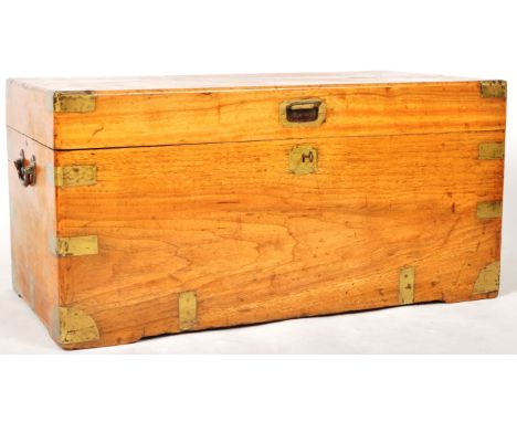 A 19th Century camphor wood steamer trunk shipping chest having brass bound corner mounts. Central cartouche panel to lid, fo