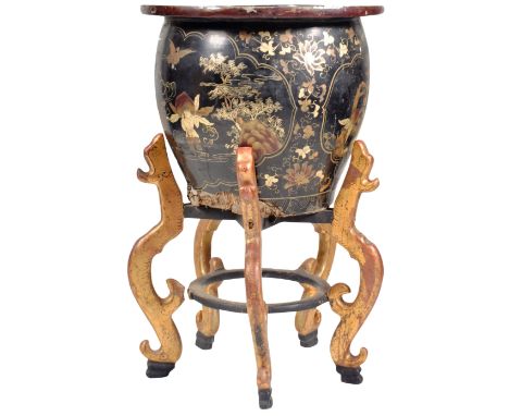 A late 19th Century Chinese large papier mache jardinière / planter of bulbous tapering form having a large lipped rim with f