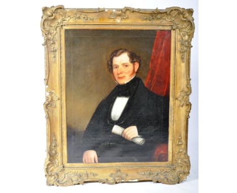 A 19th Century Victorian English oil on canvas portrait painting study depicting a gentleman wearing a black coat, seated and