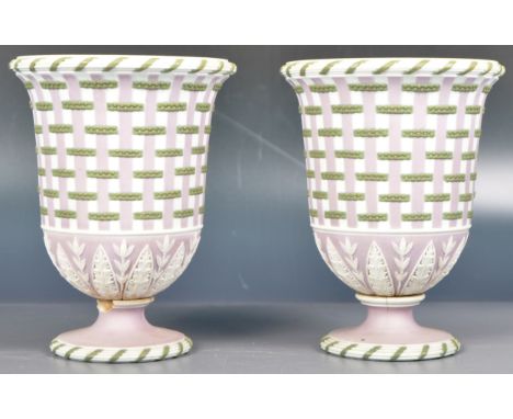 A pair of early 19th Century Wedgwood Tricolour / Tri-Colour Jasperware ceramic urns having a white ground with pink and gree