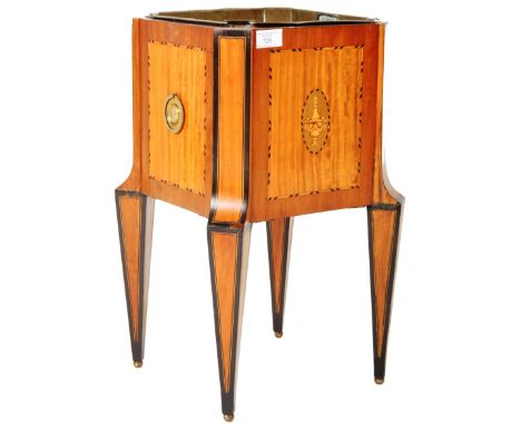 A 19th Century satinwood champagne wine cooler ice bucket having an inset brass bucket with satinwood sides inlaid with ebony