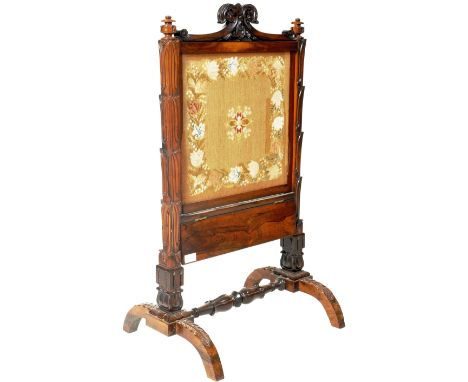 An early 19th Century William IV rosewood firescreen in the manner of Gillows of Lancaster. The firescreen having a carved or