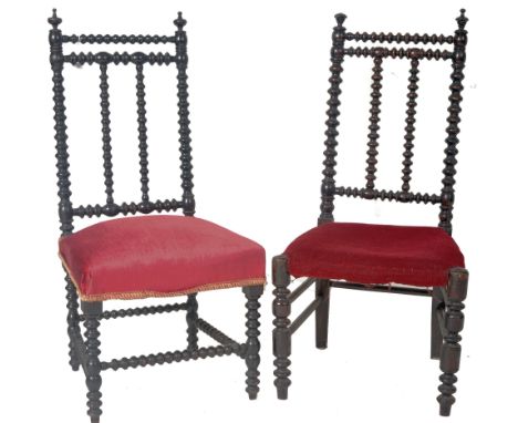 A matching pair of 19th Century Victorian ebonised side chairs having bobbin turned backrests with finais atop and twin centr