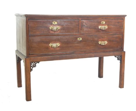 A 19th Century mahogany side table / chest on stand in the Chinese Chippendale taste comprising of a two over one bank of dra