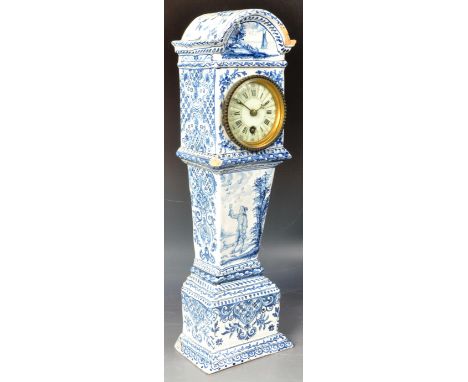 A 19th Century Dutch Delft blue and white ceramic miniature clock in the form of a longcase grandfather clock. The ceramic ca