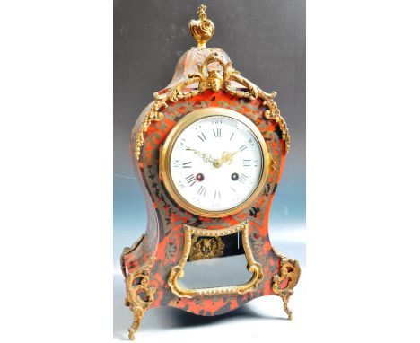 A 19th Century French Boulle Work mantel clock by Samuel Marti. The clock of shaped form with red tortoiseshell and scrolling