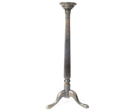 A 19th Century mahogany torchere bust / jardiniere stand having a circular top with central tapered reeded column raised on t