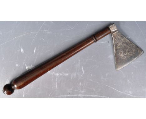 An 18th Century Northern European sugar axe comprising of a triangular form axe head mounted on a tapered turned wooden handl