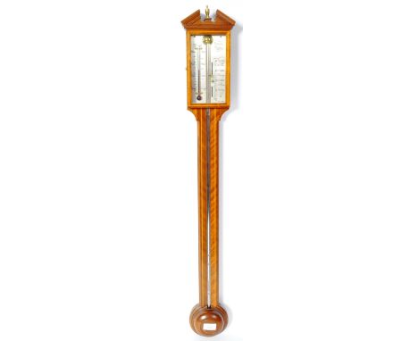 A Comitti of Holborn mahogany cased English stick barometer having an arched pediment top with brass urn finial, silvered bac