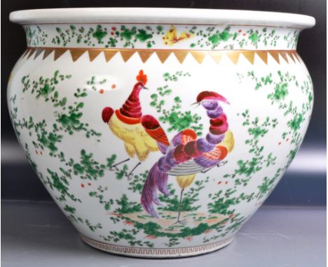 A 19th Century Chinese / Korean planter jardiniere of large size having hand painted decoration depicting birds &amp; butterf