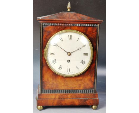 An early 18th Century George I mahogany cased table clock by Joshua Wilson of Stamford. The clock with sarcophagus shaped top