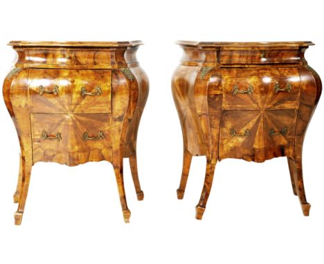 A matching pair of 19th Century Italian&nbsp;walnut commode bedside chest of drawers of bombe form with each having shaped ch