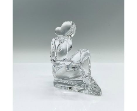 A clear figure of a nude woman reading a large book on her lap. Baccarat Rigot marked on the side. Artist: R. RigotDimensions