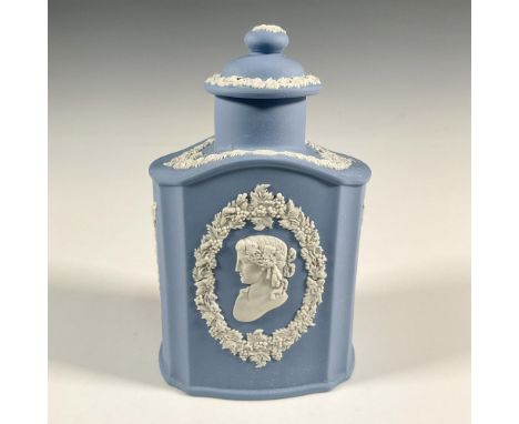 A blue jasperware tea caddy decorated in relief with white cameo and grapevine detailing; two art nouveau style lady silhouet