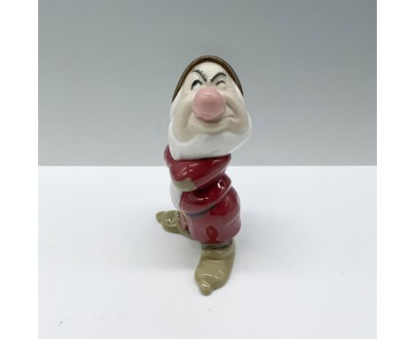 A figurine of Grumpy from Snow White that features him in his traditional outfit, arms crossed and sporting a sour expression