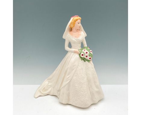 Beautiful bride in white gown holding large bouquet. Goebel backstamp. I949. Issued: 20th centuryDimensions: 7.5"L x 5.5"W x 