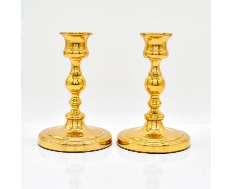 Set of two vintage decorative brass candle holders.Base marked Carolina Brass. Issued: 20th c.Dimensions: 4.75"H x 3.25" dia.
