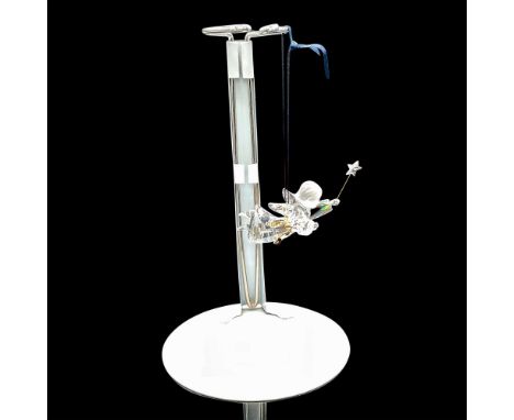 Figural is 2004 Annual edition. Clear crystal body, frosted face with gold toned sash holding star wand. Swarovski backstamp.