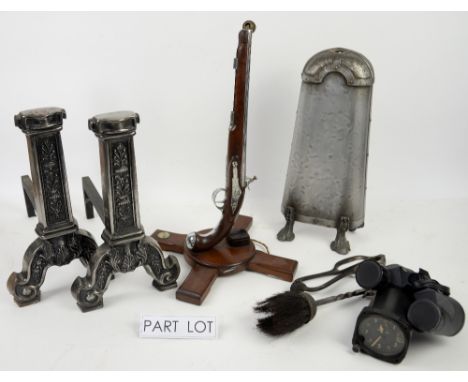 Pair of cast metal fire dogs, a lamp in the form of a pistol and other items, Mrs Beaton and other books 