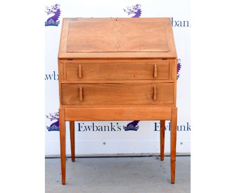 Light walnut fall front bureau over two drawers