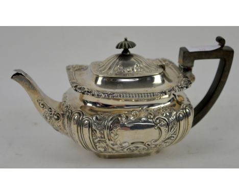 Silver teapot of shaped rectangular form with floral repousse decoration London 1898