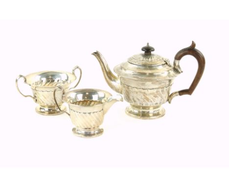 George V  bachelor's silver tea-service, by Walker &amp; Hall, Sheffield 19010/1912/1921, comprising teapot, cream jug and su