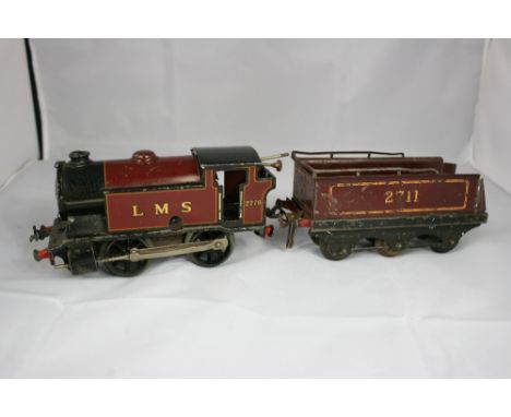 HORNBY - A Hornby tin plate train set to include a type 101 clockwork engine, various lengths of track, a railway crossing, a