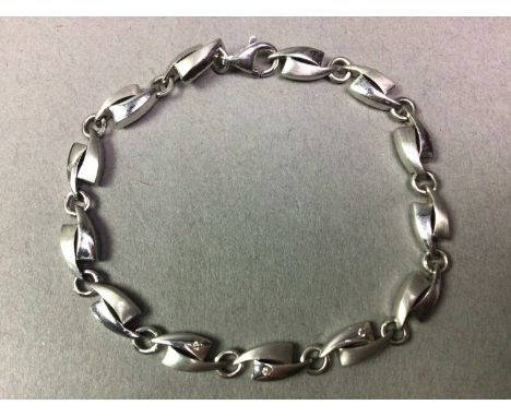 COLLECTION OF SILVER AND OTHER JEWELLERY comprising a silver bracelet formed with curved sections and inset with three tiny d