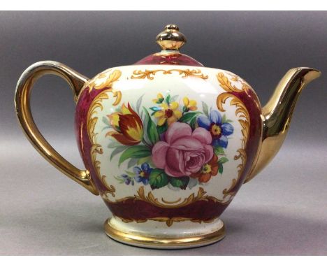SADLER TEA POT AND OTHER CERAMICS  the tea pot with floral and gilt decoration, along with a novelty tea pot, a Poole plate a
