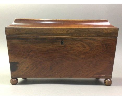 VICTORIAN ROSEWOOD TEA CADDY MID 19TH CENTURY of sarcophagus form, with hinged lid and wooden ball feet, the interior altered