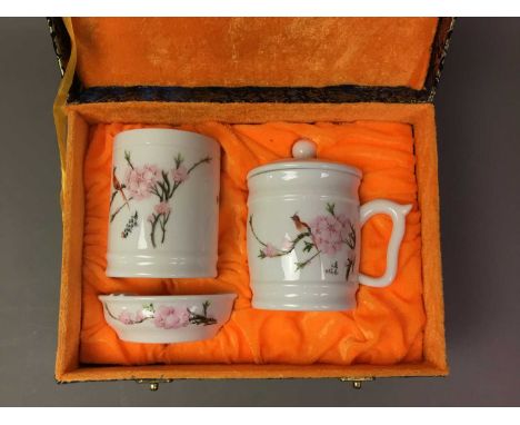 DECORATIVE CERAMIC SERVICE AND ONYX ITEMS  the ceramic service with floral decoration, in a fitted case