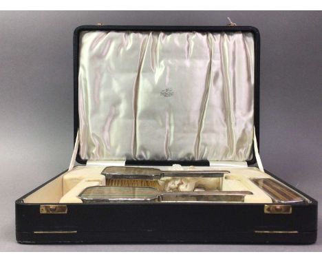 ART DECO SILVER VANITY SET BIRMINGHAM 1935 comprising a pair of brushes and another brush, each with simulated wood and green