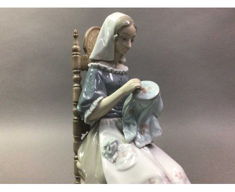 LLADRO FIGURE OF LADY EMBROIDERING modelled seated on a ladder back chair29cm high Good overall condition no obvious damage.&