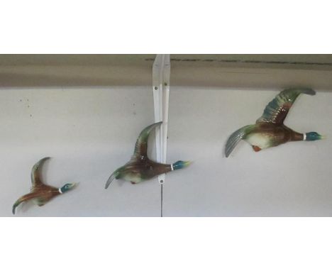 3 wall mounted flying ducks marked H O England on back ****Condition report**** Some light crazing but otherwise in good cond