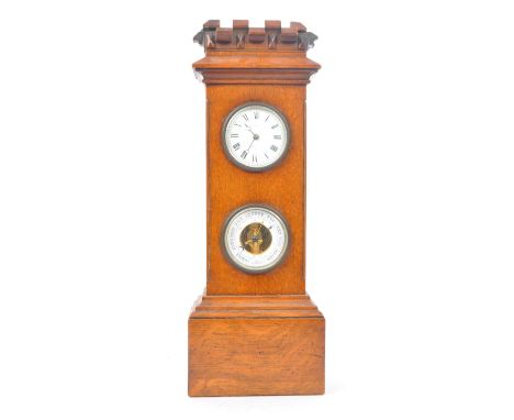 An early 20th century oak mantel clock barometer. The clock sat on a plinth base, stepped to top, below two dials for the clo