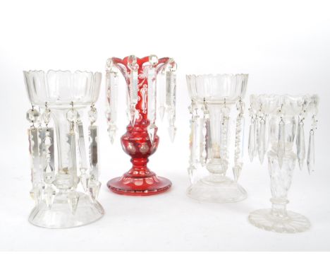 A collection of four vintage 20th century bohemian cut glass lustre vases. Of various size with cranberry example with prism 