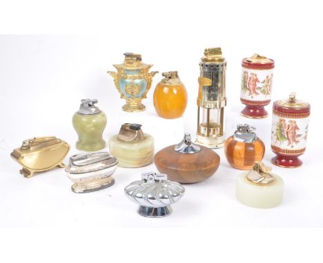 A large collection of 20th century table lighters. The collection to include a variety of examples, some of wooden constructi