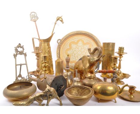 A collection of brass items to include a John Linwood roasting spit jack, candlesticks, bowls, a large jug, brass figures inc