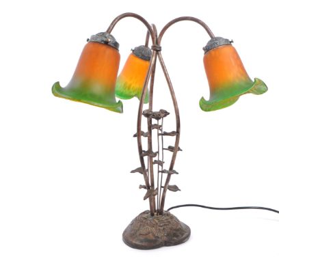 Loetz manner vintage 20th century Art Nouveau table lamp. Having three green / orange floral shape glass shades, on a curved 